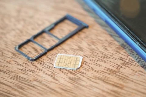 A sim card for a smart phone on table Stock Photos
