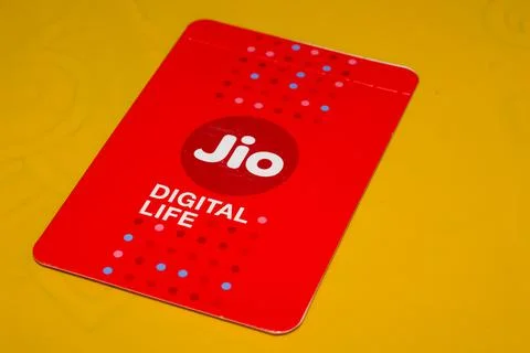 SIM Cards With Every JioFi or 4G Smartphone with Yellow Background for text Stock Photos