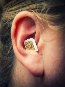 SIM in the ear Foto stock
