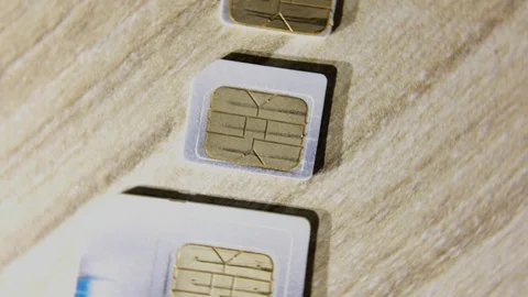 Simcard, mini Simcard, micro Simcard macro shot Rotating Turning Stock Footage 126082031