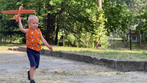 Simferopol Park Echoes with Joy: Young Pilot Exuberant Run Stock Footage 312087702