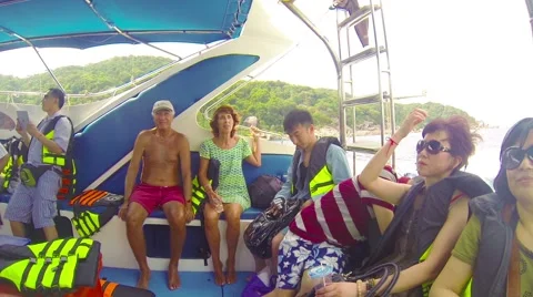 Similans, thailand - circa mar 2014: tourists from different countries go by Stock Footage 40879541