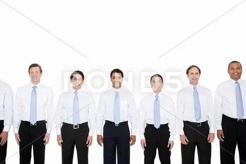 Similar looking businessmen in a row Stock Photos