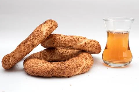 Simit and tea on white background. Stock Photos