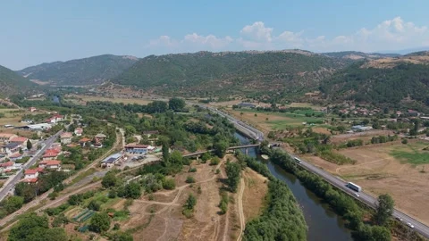 Simitli town and river valley with highway and railway in Bulgaria Stock Footage 343578247