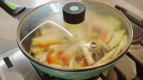 Simmer vegetables in a pan. Correct and healthy diet. Vegetarian food. Stock Footage 152676259