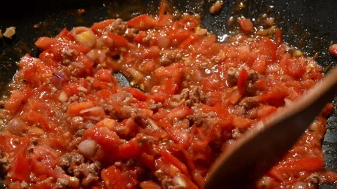 Simmering Minced Beef and Tomatoes in Pan Stock Footage 345772589