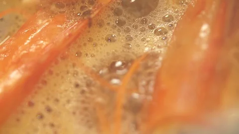 Simmering Prawn Shells, Close Up Stock-Footage 85807220