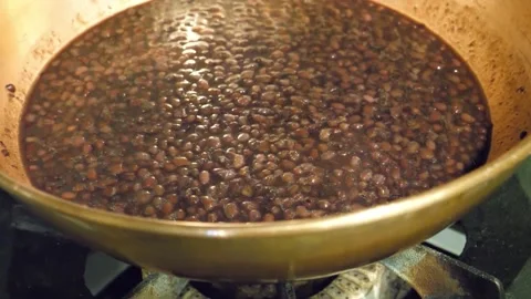 Simmering Red Azuki Beans Cooking in a Traditional Copper Pot over a Gas Flame Stock Footage 345291372