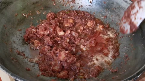 Simmering Shrimp Paste on a Cooking Pan Stock Footage 231119054
