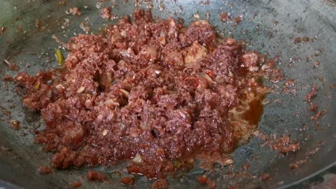 Simmering Shrimp Paste in a Pan Video stock 231118877