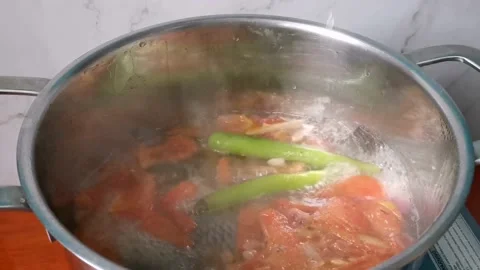 Simmering Tilapia Fish Soup with Mashed Tomatoes Stock Footage 159319771