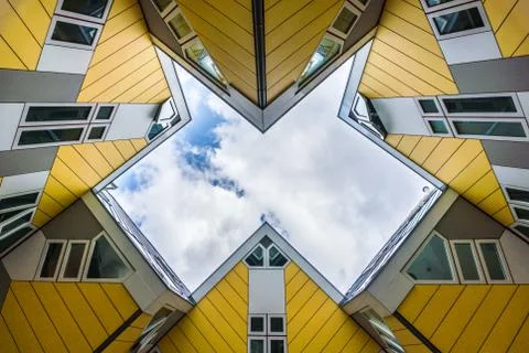 Simmetry Gleam between Yellow Cubic houses and apartments in Rotterdam. The Stock Photos