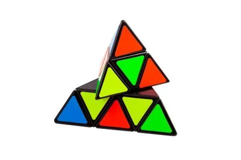 Simple abstract colorful pyramid triangular logical puzzle toy object isolated Fotos de archivo
