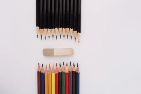Simple and colored pencils aimed at the eraser Stock Photos