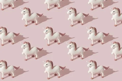 Simple and cute unicorn pattern. Pastel pink color tones. Minimal composition Stock Photos