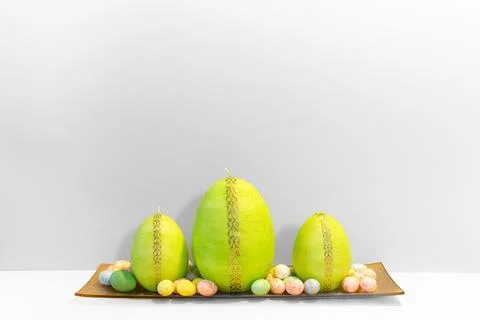 Simple and elegant Easter background with Easter egg shaped candles Fotos de archivo