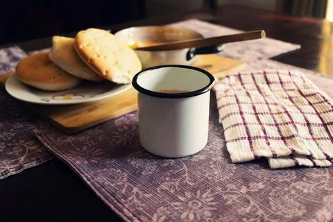 Simple and rustic breakfast with fried eggs, bread and coffee Stock Photos