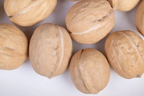 Simple arrangement of shelled nuts. Clean layout emphasizing design contras.. Stock Photos