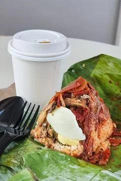 Simple authentic serving of nasi lemak bungkus, popular rice cooked with coconut Stock Photos