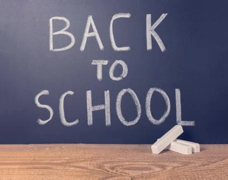 Simple background of education with text back to school is written in chalkbo Stock Photos