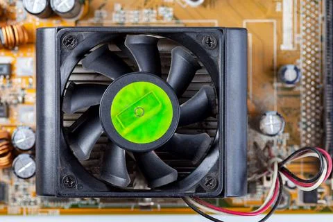 Simple basic CPU chipset fan, processor air cooler on a motherboard top view Stockfoto's