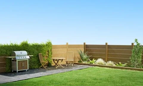 Simple beautiful backyard with seating and lush greenery, patio area with g.. Stock Photos