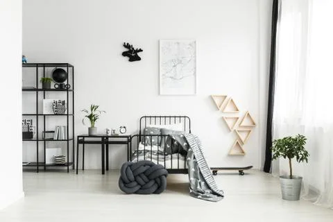 Simple bedroom with black bed Stock Photos