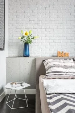 Simple bedroom with brick wall Stock Photos