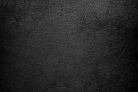Simple black Background,Leather Texture with gradient light used as luxury Stock Photos