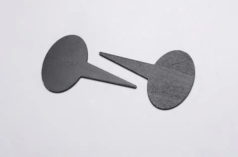 Simple black push pins on white background Stock Photos