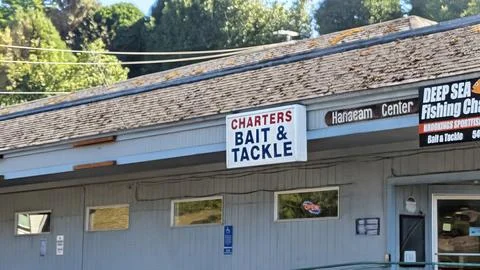 A simple blue storefront featuring “Charters Bait and Tackle” Stock Photos