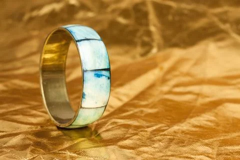 Simple bracelet on gold background Foto stock