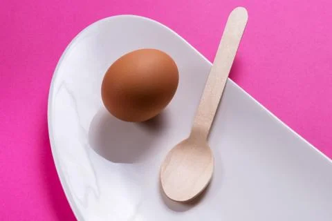 Simple breakfast, boiled egg on white porcelain Stock Photos