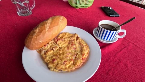 Simple breakfast - omelette with fresh bread and a cup of black hot coffee 스톡 동영상 244705109