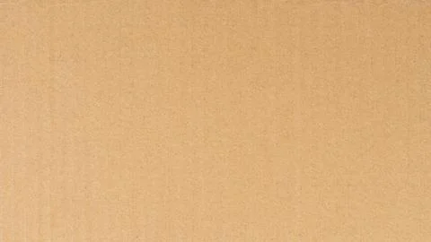 Simple brown cardboard box on flat surface Stock Photos