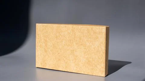 Simple brown rectangular box on gray background 写真素材