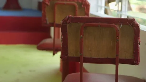 Simple chairs with red cushions Stock Footage 76330878