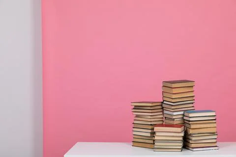A simple composition of many books, stack or pile of books on wooden table, one Stock Photos
