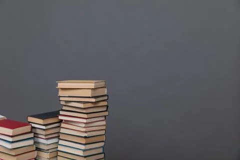 A simple composition of many books, stack or pile of books on wooden table, one Stock Photos
