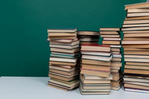 A simple composition of many books, stack or pile of books on wooden table, one Stock Photos