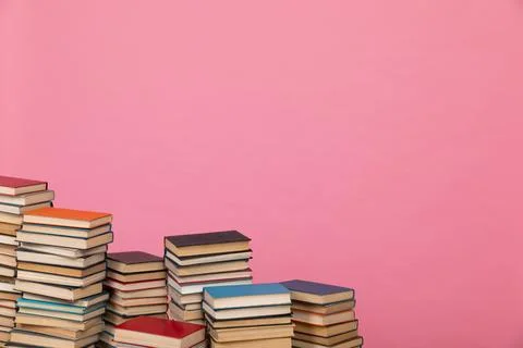 A simple composition of many books, stack or pile of books on wooden table, one Stock Photos