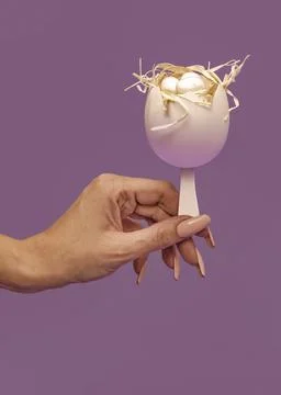 A simple concept of Easter. Half of a white egg shell decorated with light Stock Photos