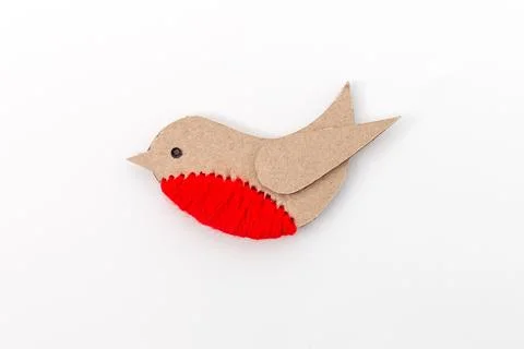 Simple craft representation of a bird made from cut-out pieces of material .. Stock Photos