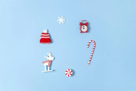 Simple creative Christmas composition. Candy cane, deer, hat, snowflake, red Stock Photos