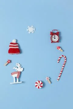 Simple creative Christmas composition. Candy cane, deer, hat, snowflake, red Stock Photos