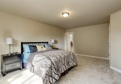 Simple design interior of beige Woman's bedroom on the second floor. There is Stock Photos
