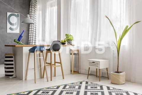 Simple dining area with plant Stock Photos