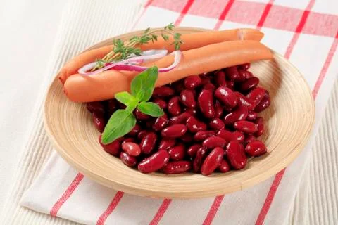 Simple dish of red beans and frankfurters Stock Photos
