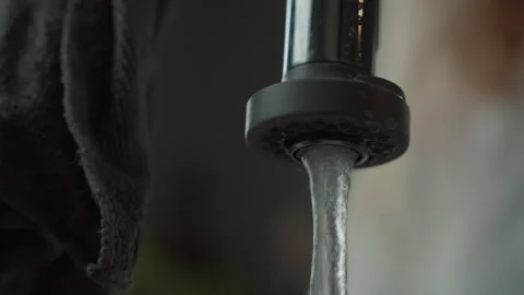 Simple dish washing routine with tap water in the kitchen sink at home Stock Footage 321379369
